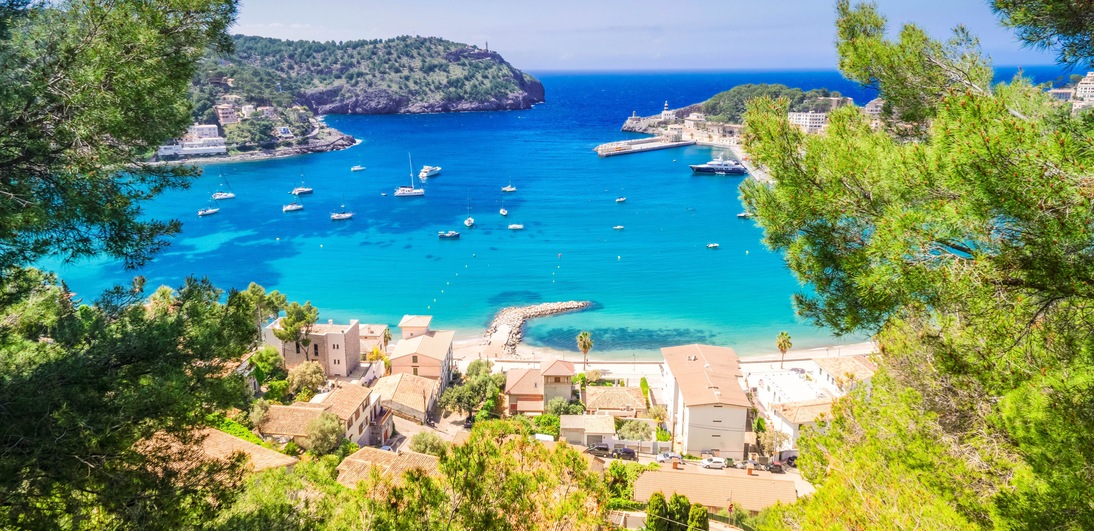 view of Port Soller harbour with house roofs, Mallorca at summer, Spain