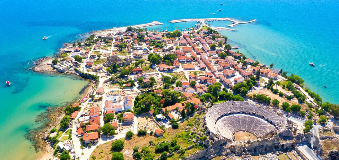 Aerial top drone view of ancient Side town with amphitheater, Antalya Province in Turkey.