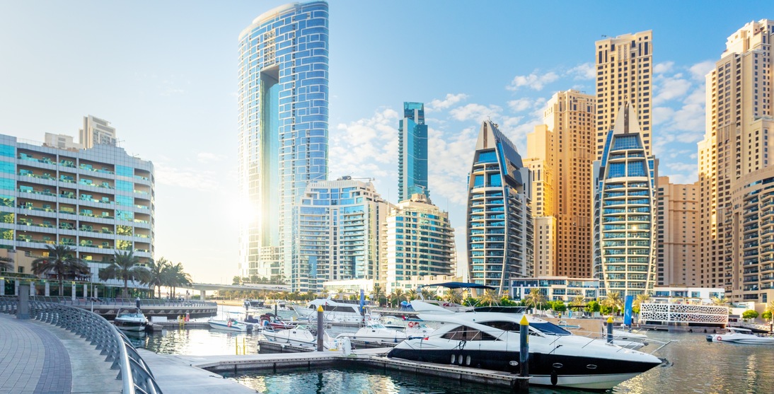 Beautiful view of Dubai Marina with modern buildings and yachts in the water.